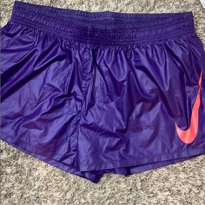 NWT Nike Women's Purple Athletic Shorts with Neon Orange Emblem